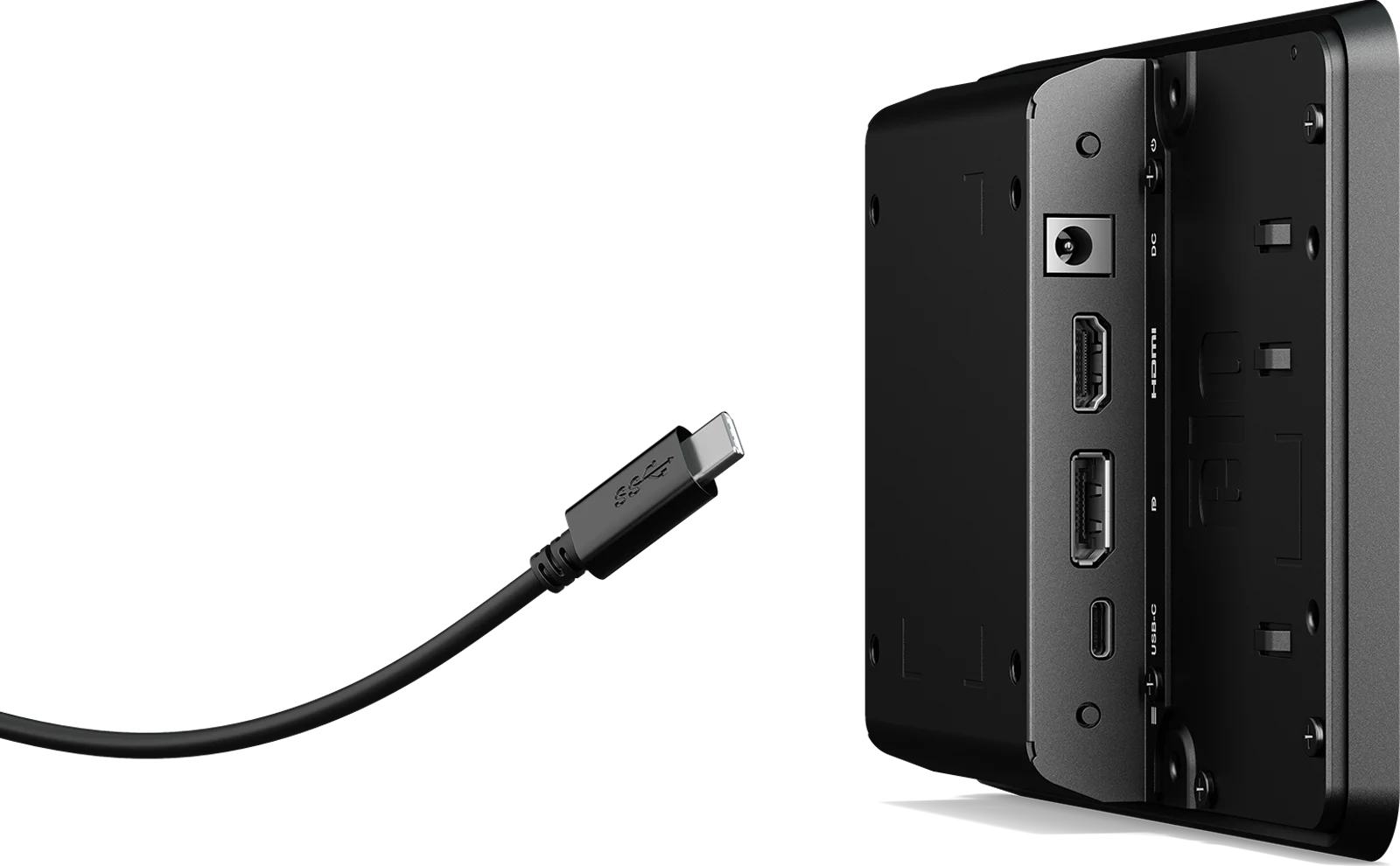 Type C cable hovering near rear peripheral ports, prominently displaying available ports.